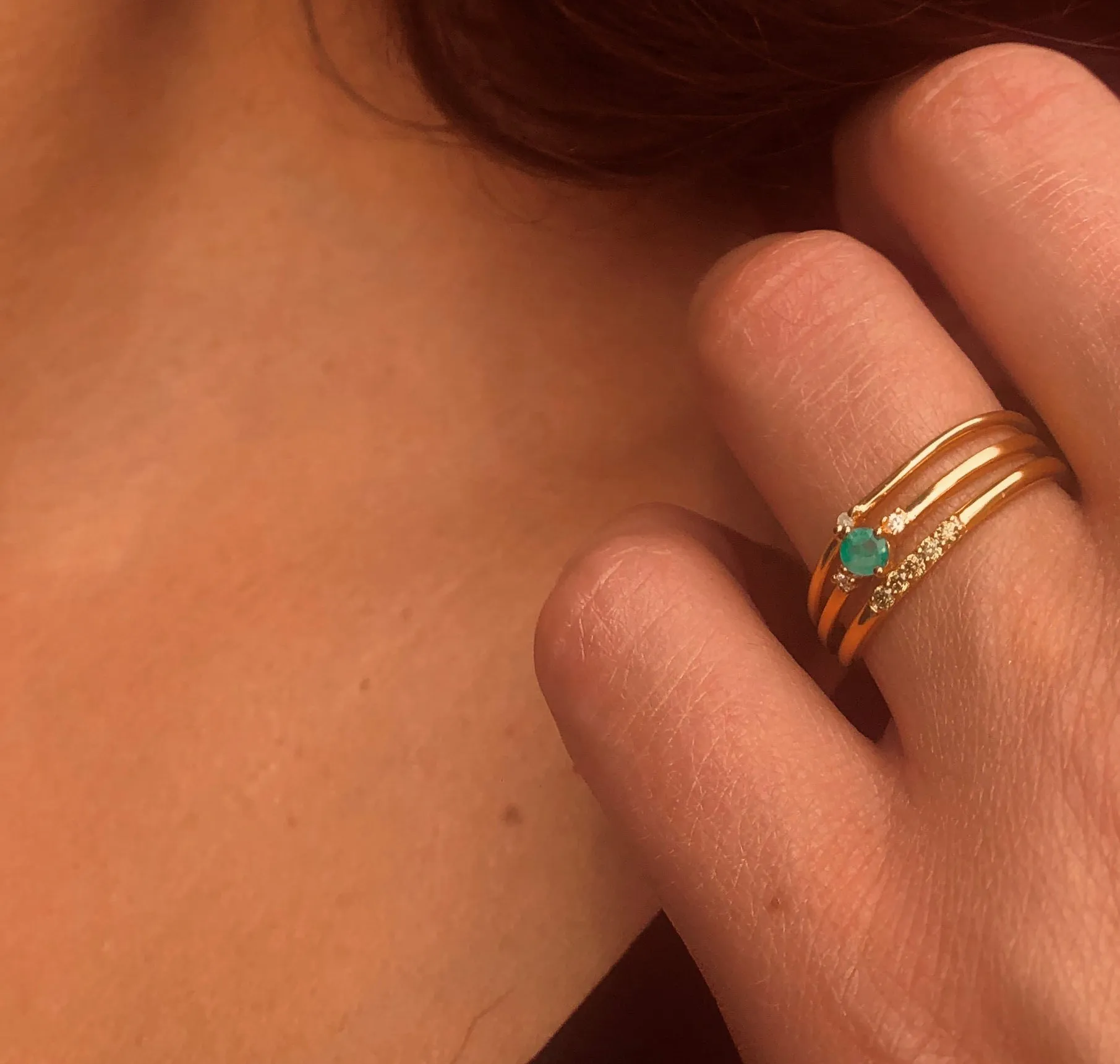 Composition of rings in 925 Silver gilded with 18k yellow gold assembled with HSI Diamond, Emerald, Peridot and Zirconium Oxide